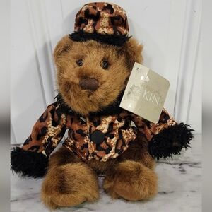 Vintage Dakin Chelsea Sitting Teddy Bear wearing a cheetah print coat and hat
